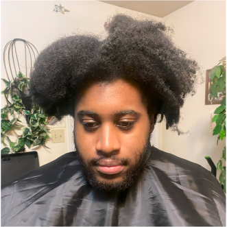 a customer of the mobile barbershop of virginia beach getting their haircut