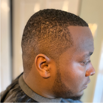 a customer of the mobile barbershop of virginia beach getting their haircut