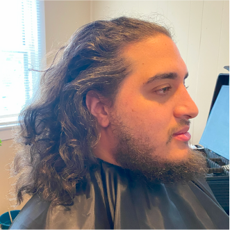 a customer of the mobile barbershop of virginia beach getting their haircut