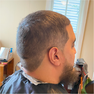 a customer of the mobile barbershop of virginia beach getting their haircut