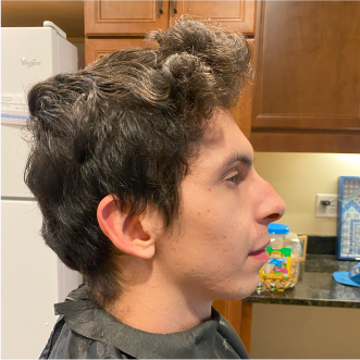 a customer of the mobile barbershop of virginia beach getting their haircut